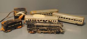 Group of Five Model Train Cars and Transformer Description