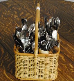 Divided Wicker Basket with Large Group of Silverware Description
