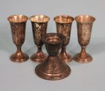 Set of Four Preisner Silver Company Sterling Cordials and a Sterling Weighted Candle Stick