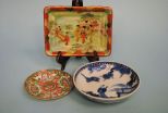 Three Oriental Porcelain Pieces Including One Famille Rose Dish, Blue and White Garden Scene Dish, Celedon Tray With Geisha Girls