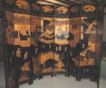 Chinese Carved Black Lacquer Eight Panel Screen in Coramandel Art Form