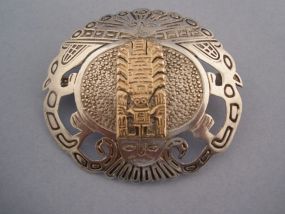 Sterling Broach with Aztec symbols.