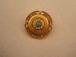 Small Gold Broach with Turquoise Center.
