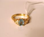 18kt gold ring with blue topaz 1.5 ct