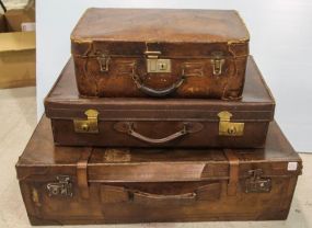Three Various Sized Leather Suitcases