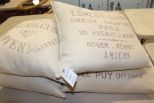 Four Beige Throw Pillows