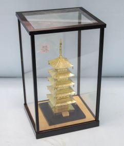 Gold Metal Pagoda in Glass Display