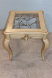 Distressed Cream Colored Side Table with Metal Leaf Design