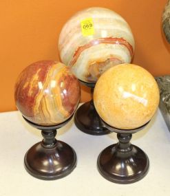Three Stone Spheres on Stands