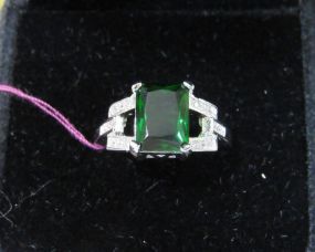 Emerald Cut Green Stone with Small Clear Stone Accents in a Silvertone Setting