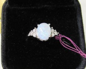 Faux Opal Cabochon Shaped Stone with Round Clear Accents in a Silvertone Setting
