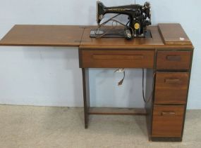 Singer Sewing Machine In Cabinet with Attachments and Manual