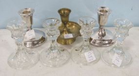 Four Glass Candlesticks, Two International Silverplate Candlesticks, and a Brass Chamberstick