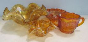 Four Pieces of Marigold Carnival Glass