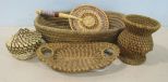 Oval Sweet Grass Basket, Two Pine Needle Baskets, a Sweet Grass Basket with Vinyl Weave, and a Sweet Grass Hand Held Fan