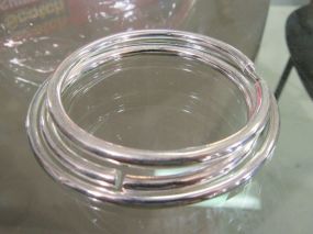 Three Silver Bangle Bracelets