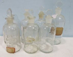 Seven Vintage Apothecary Bottles with Stoppers