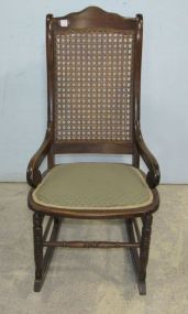 Rocker with Cane Back and Upholstered Seat