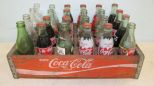 Vintage Coca Cola Crate with Empty and Full Bottles in Green and Clear Glass
