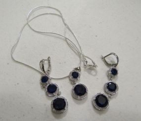 Marked .925 Chain with Two Blue Stone pendant and Pair of Blue and Clear Stone Earrins