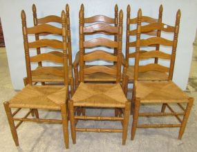 Six Oak Ladder Back Chairs