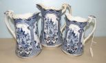 Three Flow Blue Style Graduated Pitchers