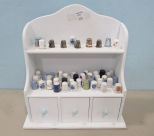 White Display Shelf with Forty Six Thimbles