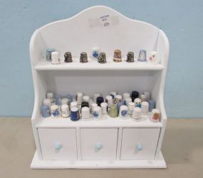 White Display Shelf with Forty Six Thimbles