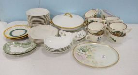 Assortment of China and Pottery Plates, Cups.