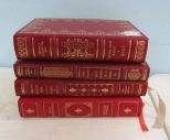 Four Red Leather Bound Books