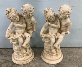 Pair of Ceramic Hand Painted Children Statues