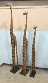 Three Large Wood Giraffe Statues