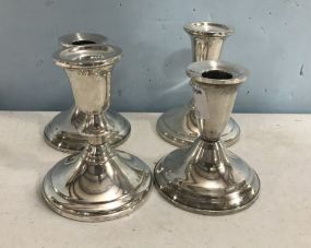 Four Sterling Weighted Candle Holders