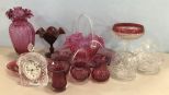 Group of Red, Pink, and Clear Glass Decor