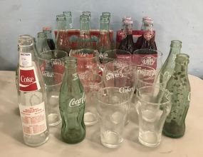 Collection of Coke Cola Bottles and Cups
