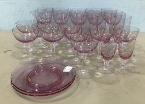 Set of Pink Glass Stemware and Plates