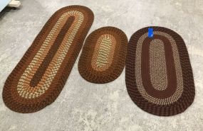 Three Small Woven Oval Rugs