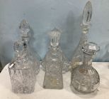 Group of Six Pressed and Etched Glass Decanters