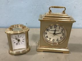 Two Small Brass Howard Miller Clocks