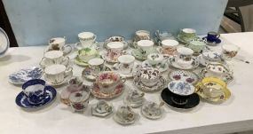 Large Collection of Porcelain Demi Tasse Cups and Saucers