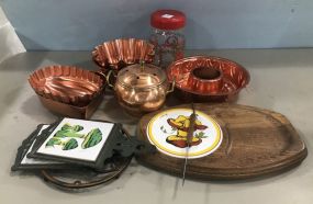 Group of Cooking Molds, Cutting Board, Trivets, and Jar