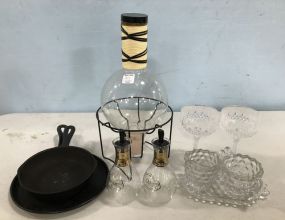 Group of Clear Glass Cups, Decanter, and Iron Pans