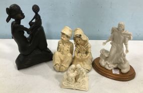 Four Decorative Statues