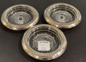 Three Sterling Rim Glass Coasters