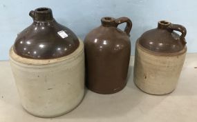 Three Brown Stoneware Crock Jugs