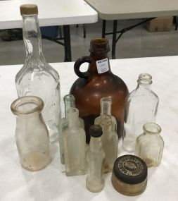 Assorted Collection of Glass Bottles and Medicine Bottles
