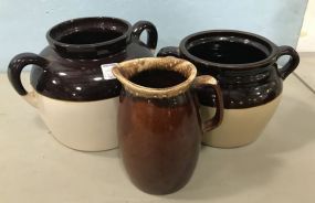 Three Brown Stoneware Pottery Crocks and Hull Pottery Pitcher