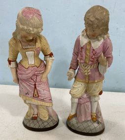 Two Bisque Boy and Girl Porcelain Figurines