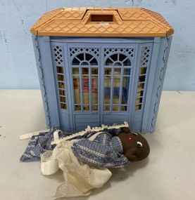 Child's Plastic Doll House and African American Cloth Doll