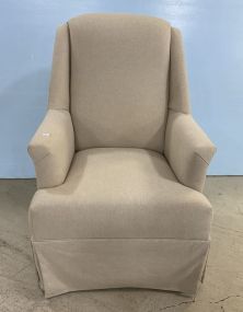 Upholstered Tan Swivel Arm Chair